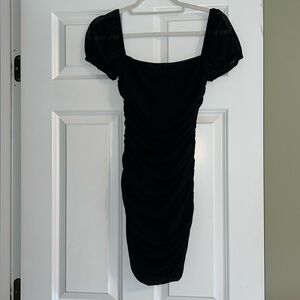 Black mini dress,  ruched,  fully lined with mesh overlay,  sheer cap sleeves